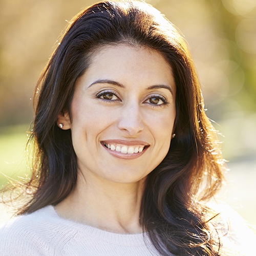 Woman smiling outdoors