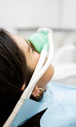 Patient relaxing as they receive dental sedation