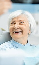 Periodontist and patient reviewing dental X-ray