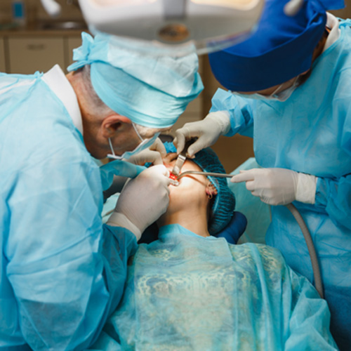 Dental team carefully working during sinus lift surgery