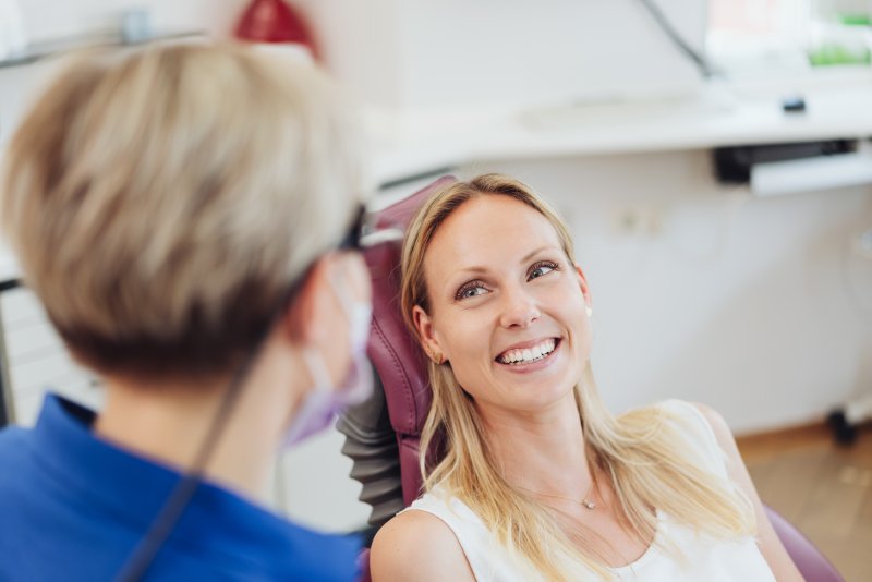 A periodontist in Huntington Beach talking to a patient.