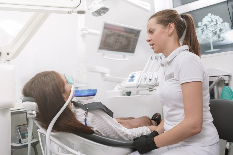 Periodontist in Huntington Beach providing sedation dentistry to a patient