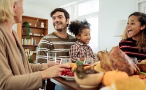 a family enjoying Thanksgiving dinner together